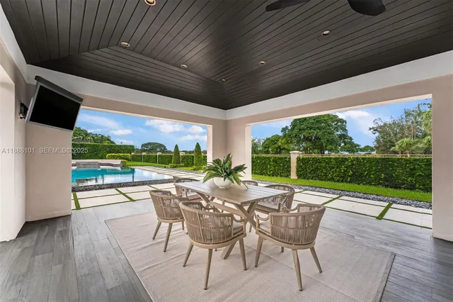 a bathroom with a double vanity sink mirror and bathtub
