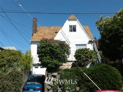 816 North 46th Street Seattle, WA 98103 - Photo 1 of 21 a view of a house with a yard