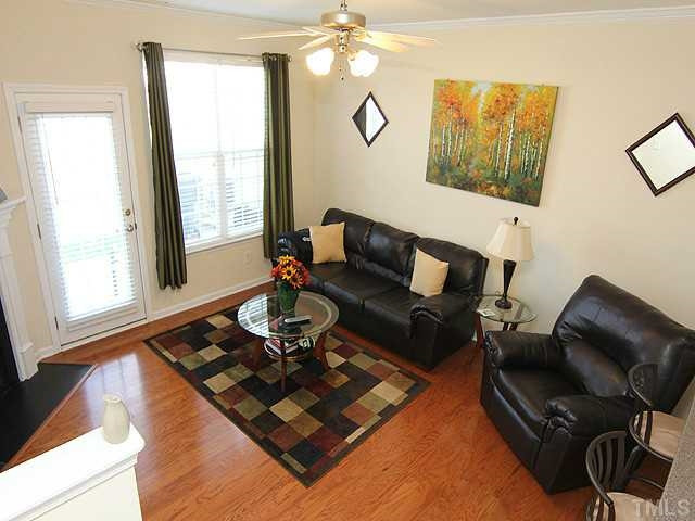 106 Cedar Elm Road Durham, NC 27713 - Photo 5 of 23 a living room with furniture rug and window