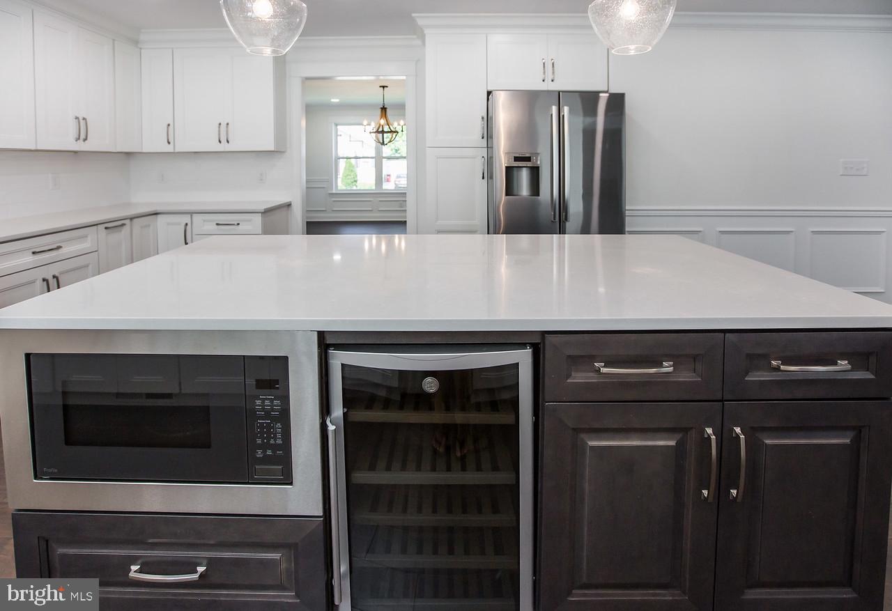 416 Coles Mill Road Haddonfield, NJ 08033 - Photo 22 of 57 Island with microwave and wine fridge