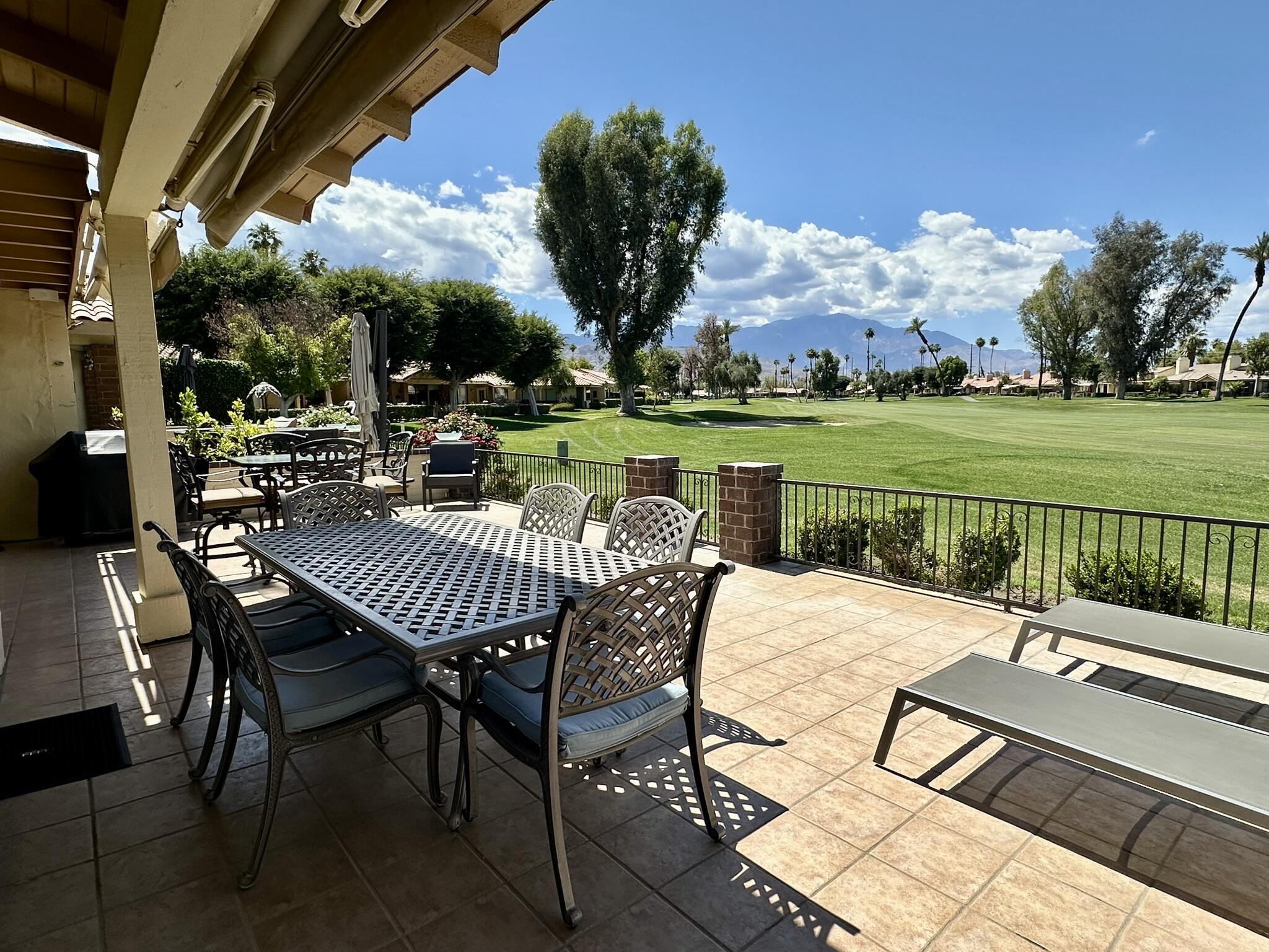 264 Ave Del Sol Palm Desert, CA 92260 - Photo 2 of 15 a view of a patio with a table chairs and a table