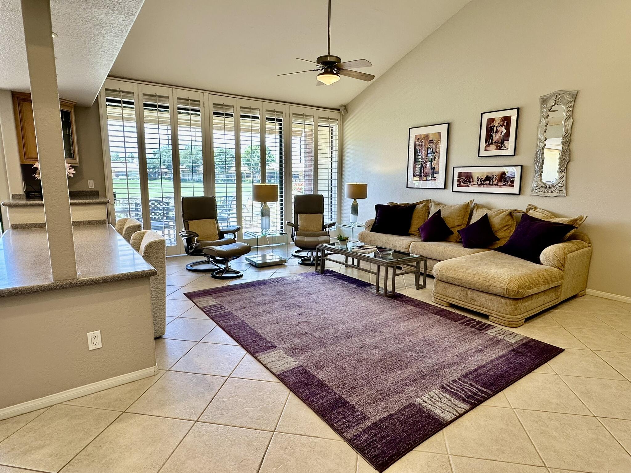 264 Ave Del Sol Palm Desert, CA 92260 - Photo 6 of 15 a living room with furniture rug and large window