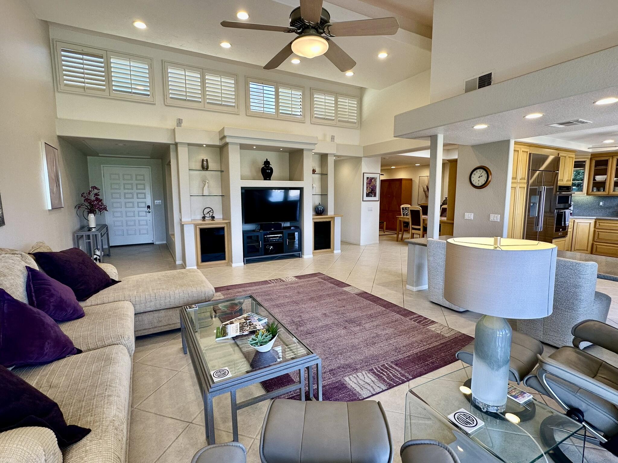 264 Ave Del Sol Palm Desert, CA 92260 - Photo 7 of 15 a living room with furniture a table and kitchen view