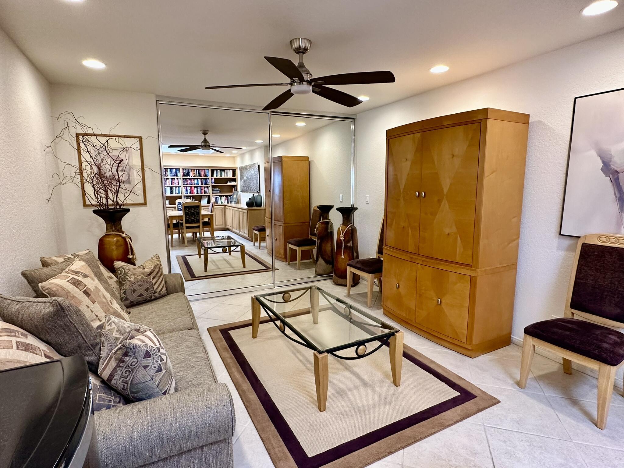 264 Ave Del Sol Palm Desert, CA 92260 - Photo 9 of 15 a living room with furniture a ceiling fan and a rug