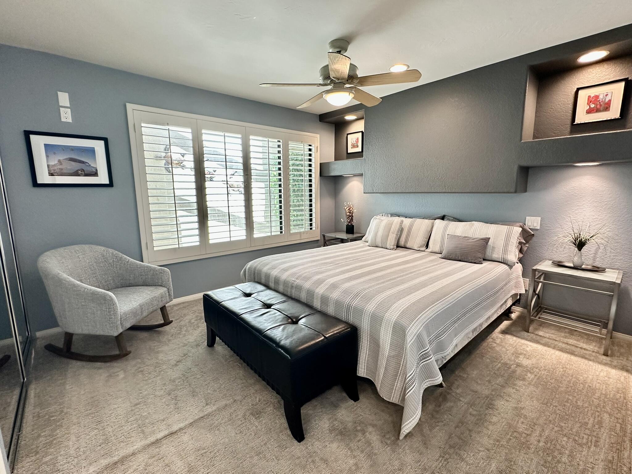 264 Ave Del Sol Palm Desert, CA 92260 - Photo 10 of 15 a spacious bedroom with a bed and a couch