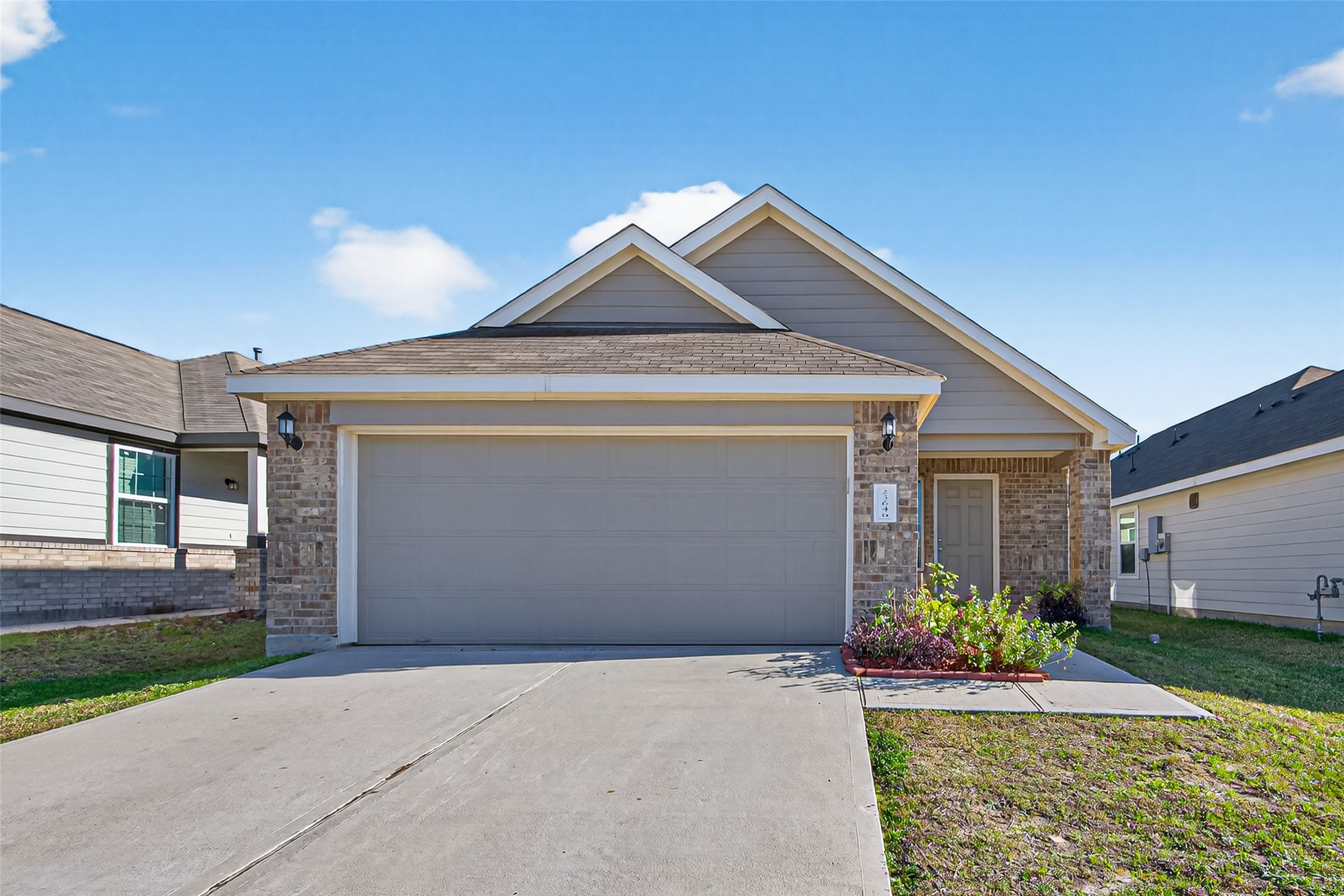 a front view of a house with garden