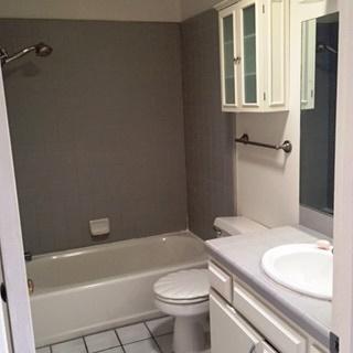 4344 Modoc Road, Unit 14 Santa Barbara, CA 93110 - Photo 7 of 10 a bathroom with a granite countertop toilet sink and mirror