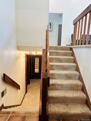 a white toilet sitting next to a bathroom sink