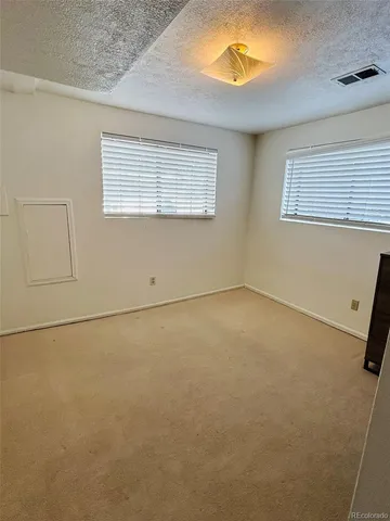 a kitchen with a stove and a refrigerator