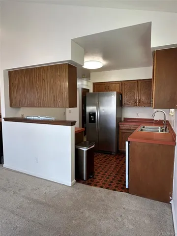 a stove top oven sitting inside of a kitchen