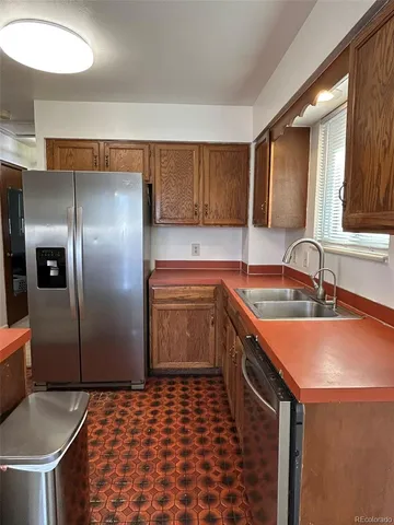a bathroom with a toilet and a shower curtain