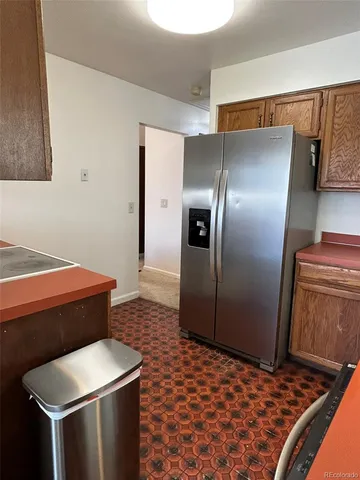 a bathroom with a sink a toilet a mirror and shower curtain