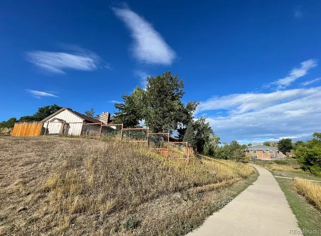 a view of a kitchen with cabinets and a stove top oven
