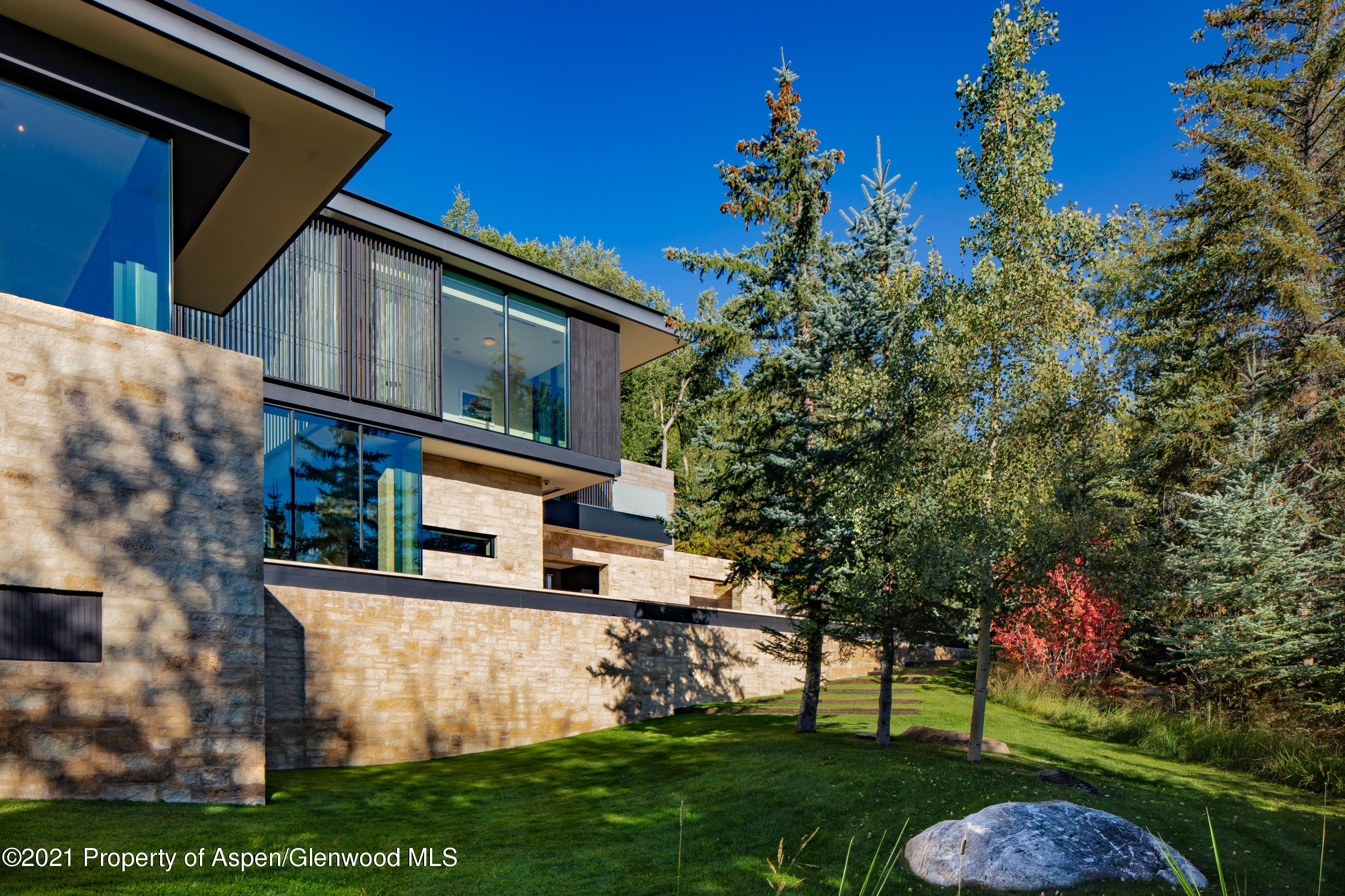 979 Red Mountain Road Aspen, CO 81612 - Photo 20 of 20 a front view of a house with a garden