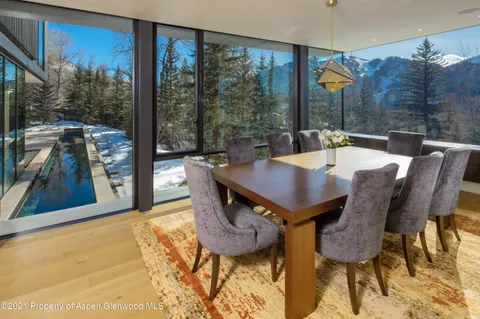 a view of a dining room with furniture window and outside view