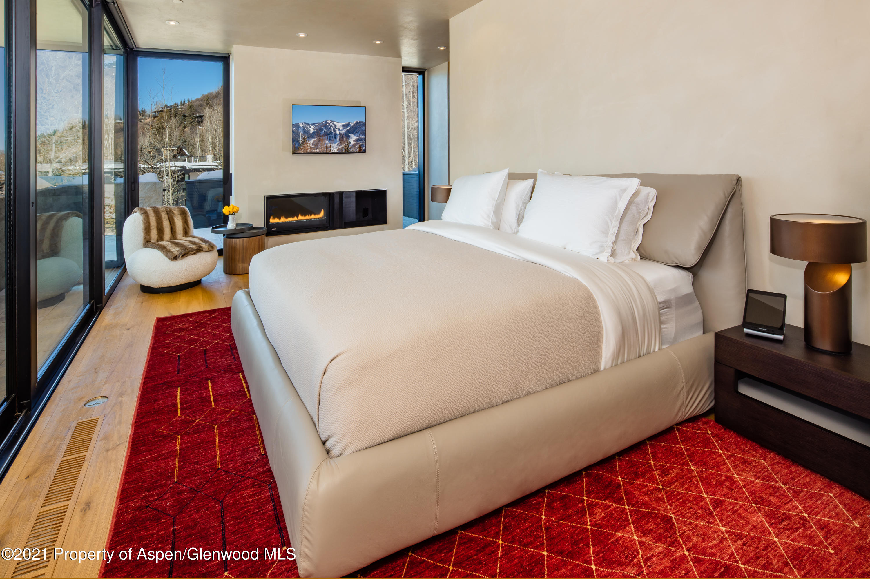 979 Red Mountain Road Aspen, CO 81612 - Photo 10 of 20 a bed room with a bed and a couch