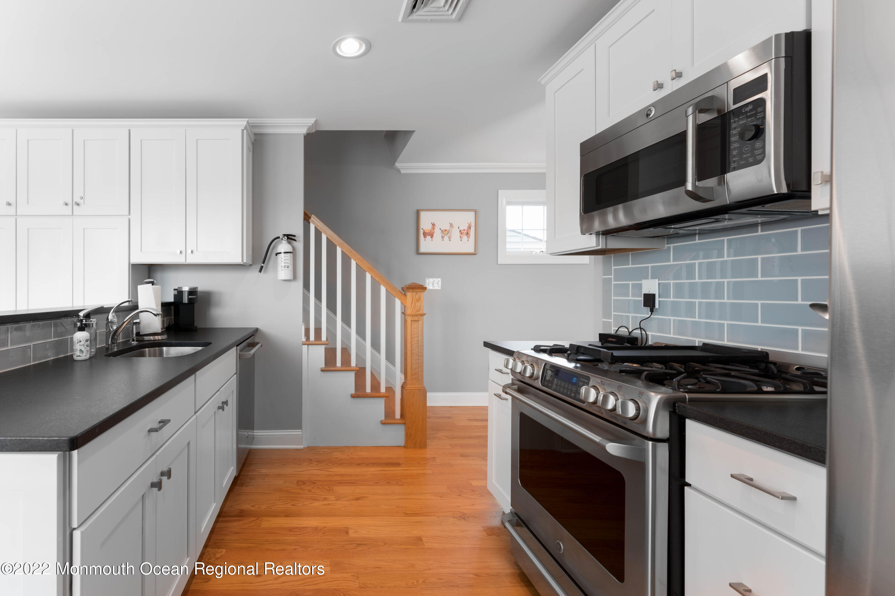 544 Brielle Road Manasquan, NJ 08736 - Photo 12 of 20 a kitchen with stainless steel appliances granite countertop a stove and a microwave