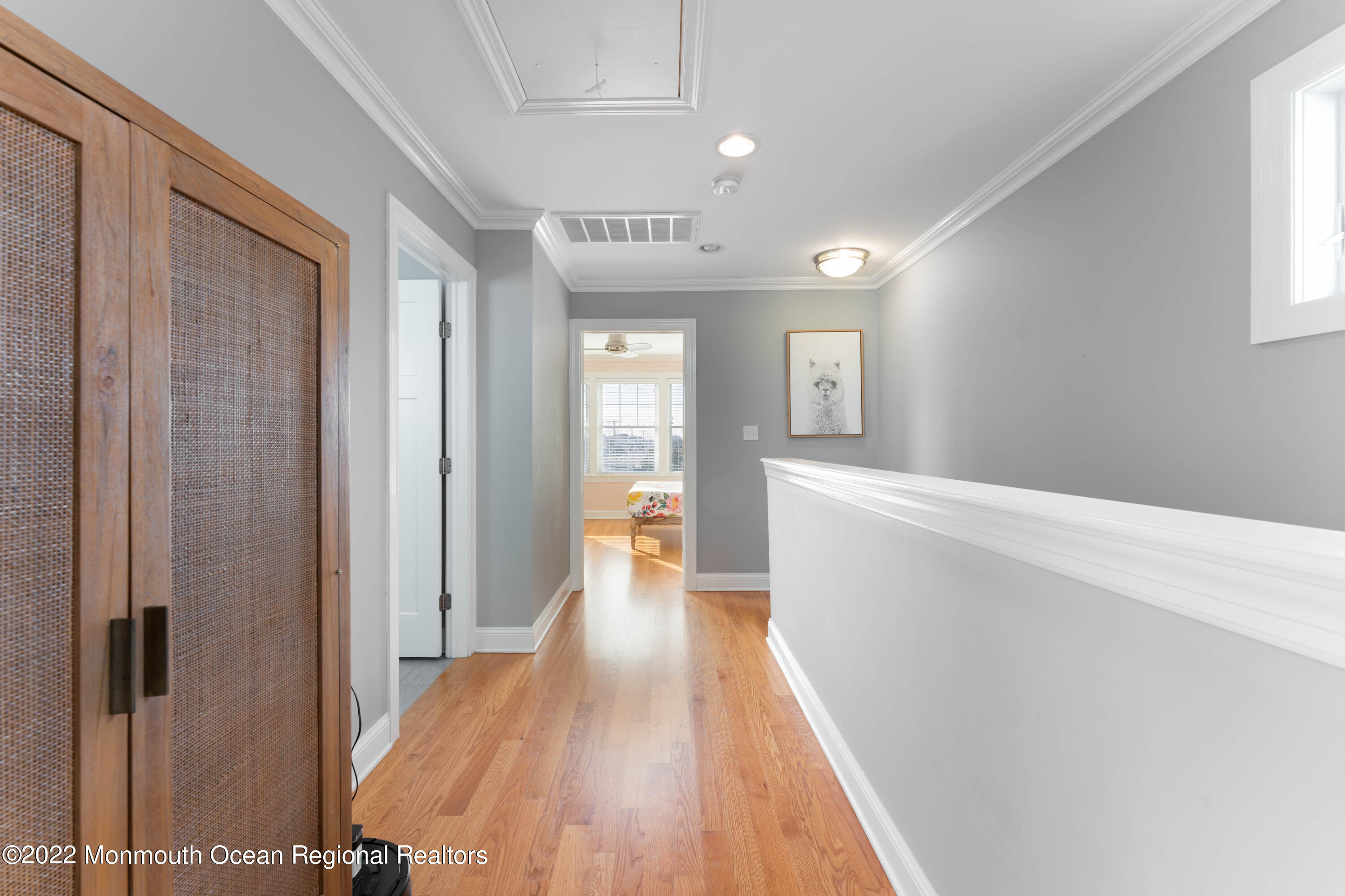 544 Brielle Road Manasquan, NJ 08736 - Photo 14 of 20 a view of a hallway with wooden floor and staircase