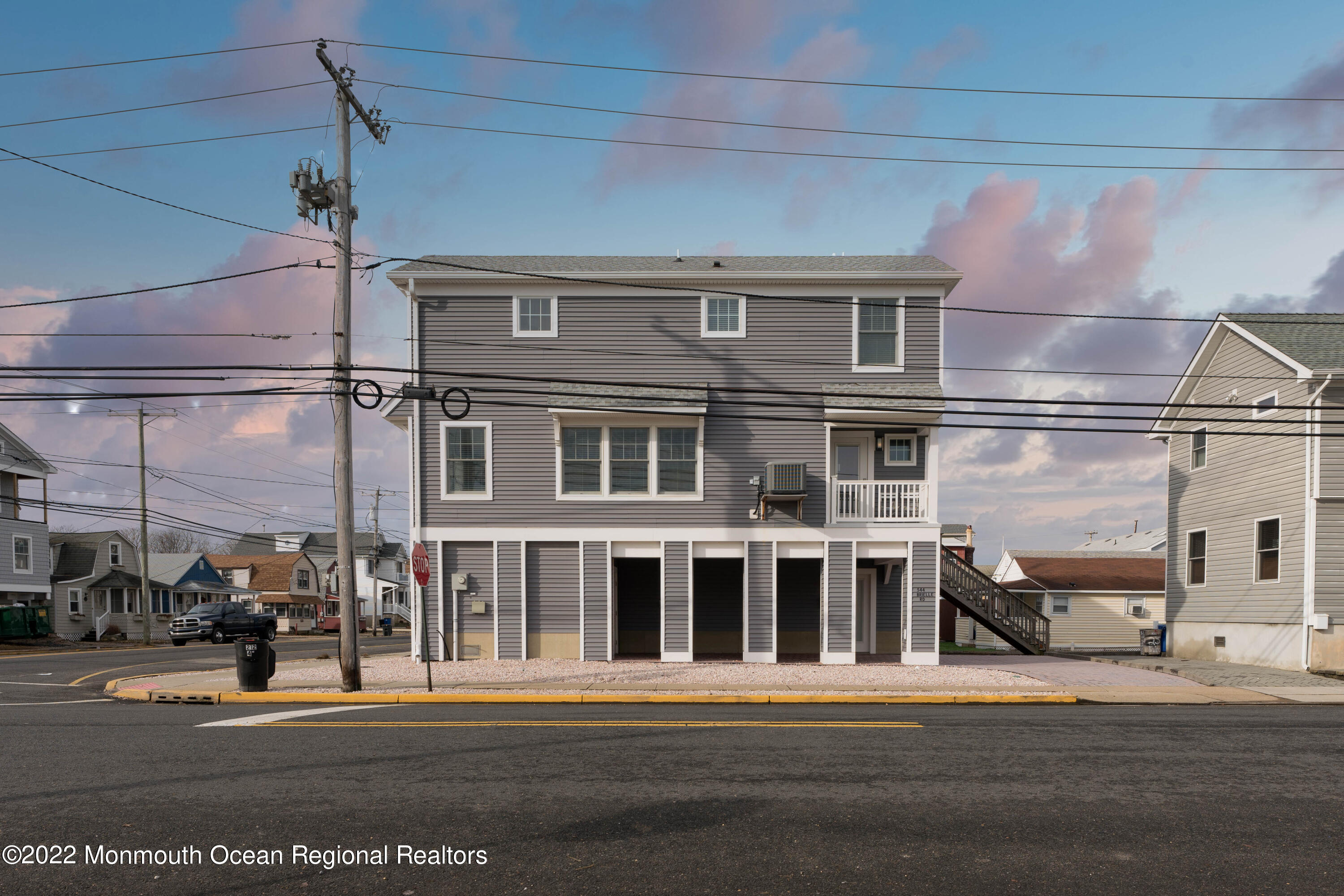 544 Brielle Road Manasquan, NJ 08736 - Photo 3 of 20 a front view of a building with a street