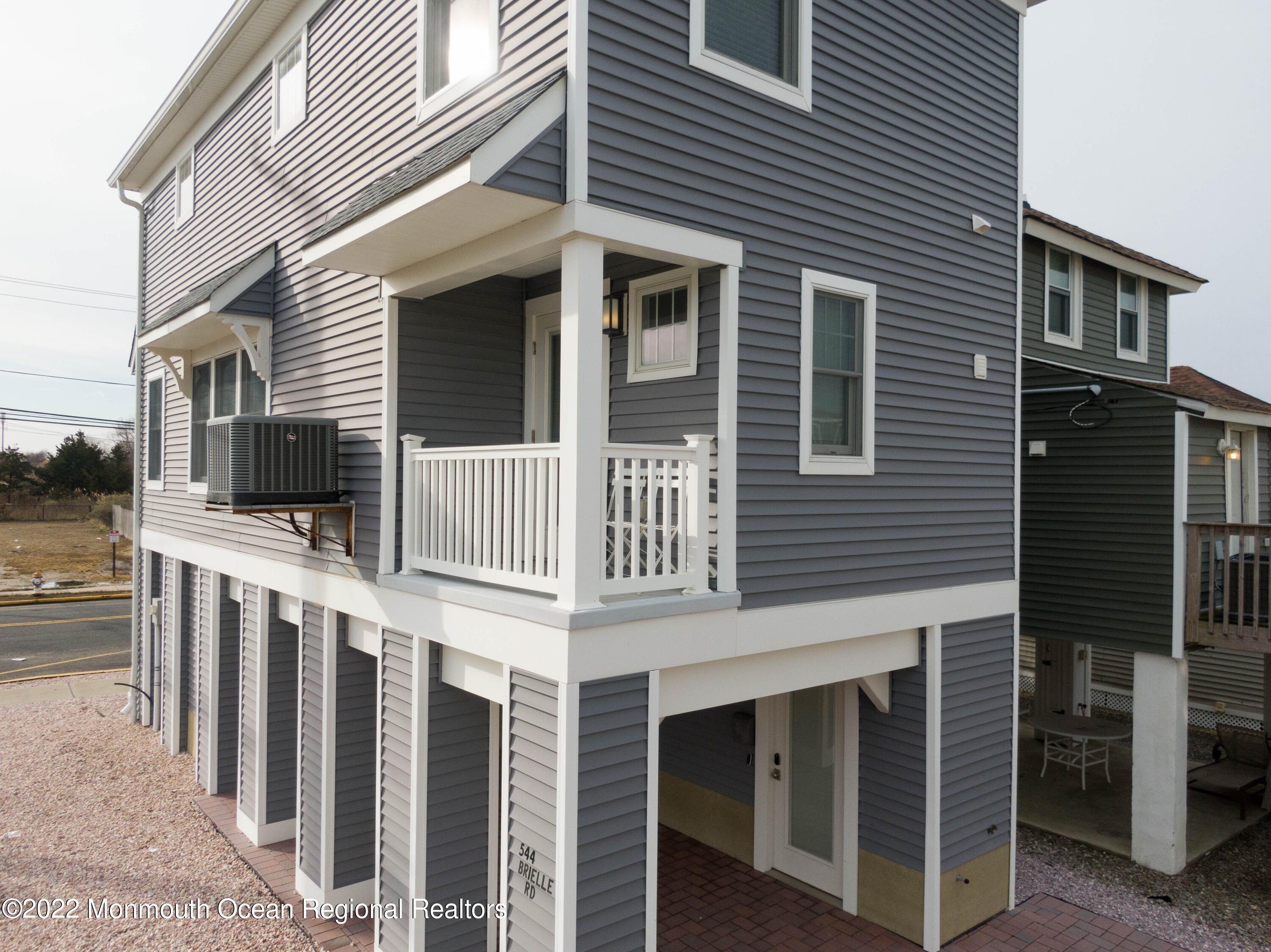 544 Brielle Road Manasquan, NJ 08736 - Photo 5 of 20 a front view of a house with balcony