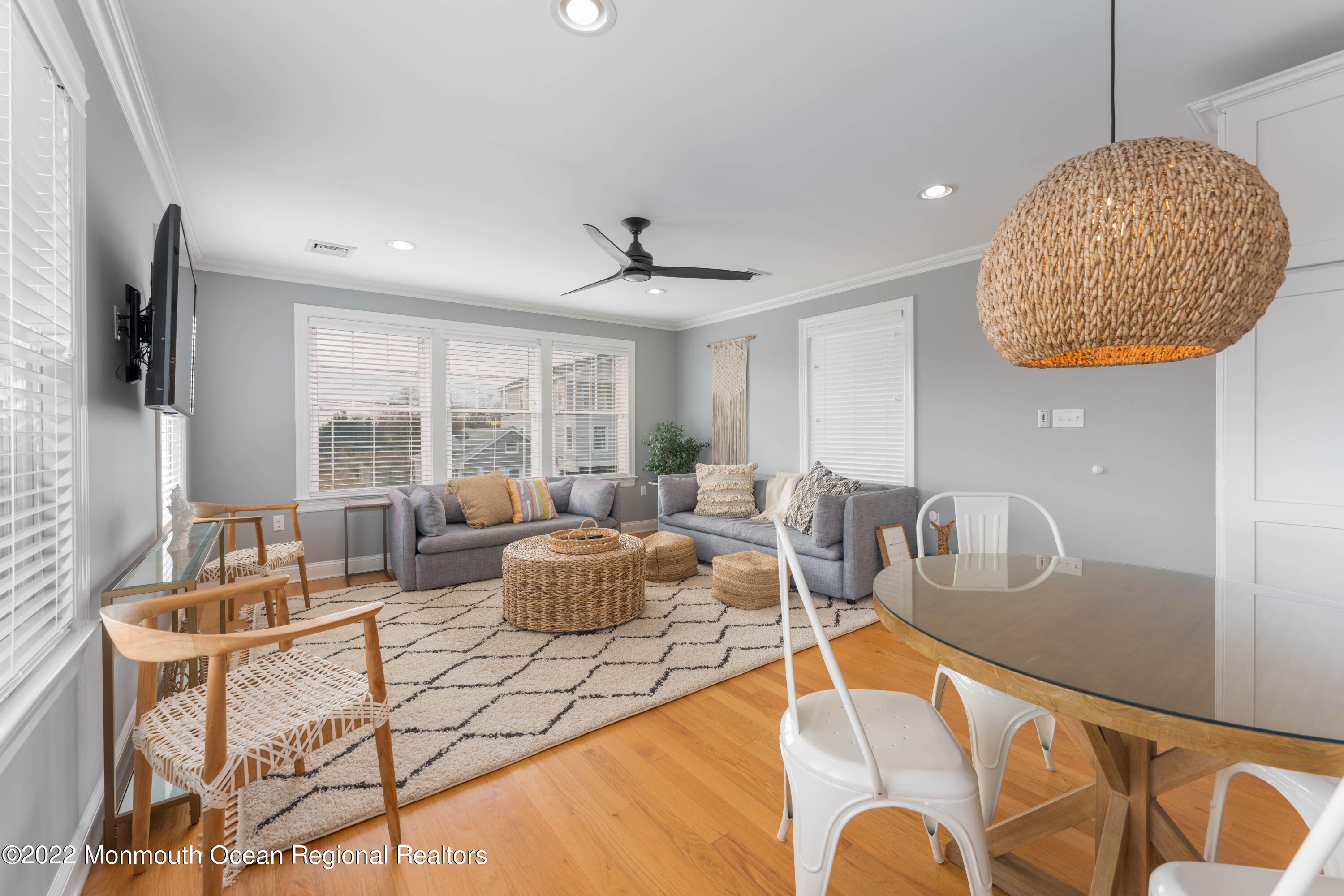 544 Brielle Road Manasquan, NJ 08736 - Photo 9 of 20 a living room with furniture a chandelier and a large window