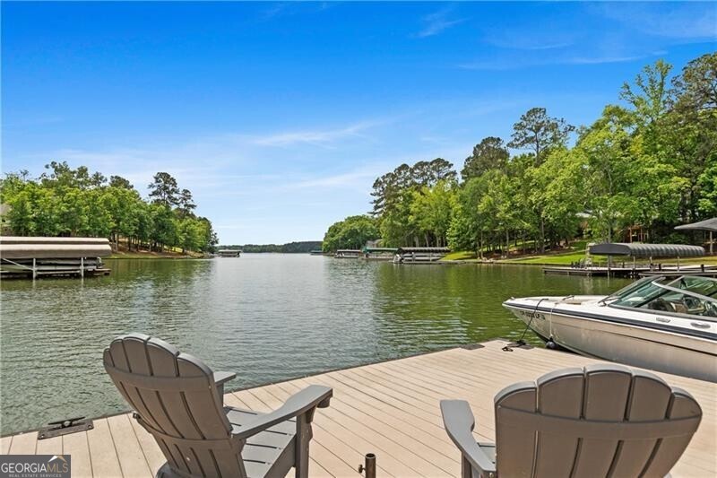 1041 Fox Chase Run Greensboro, GA 30642 - Photo 12 of 45 a view of a lake with couches chairs