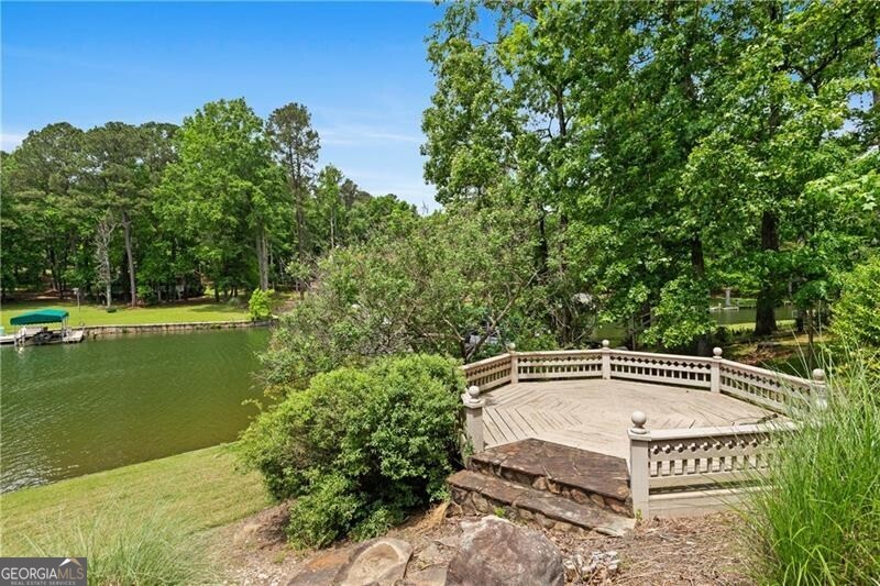 1041 Fox Chase Run Greensboro, GA 30642 - Photo 13 of 45 a front view of a house with a garden