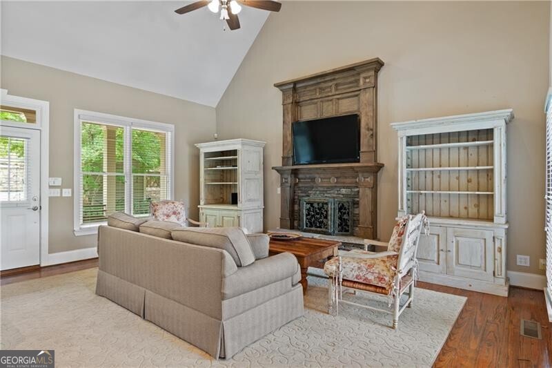 1041 Fox Chase Run Greensboro, GA 30642 - Photo 20 of 45 a living room with furniture and a fireplace