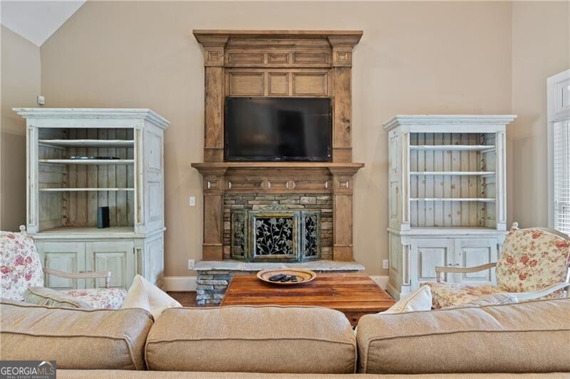1041 Fox Chase Run Greensboro, GA 30642 - Photo 22 of 45 a living room with furniture and a fireplace