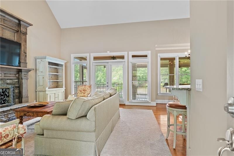 1041 Fox Chase Run Greensboro, GA 30642 - Photo 23 of 45 a living room with furniture and large windows