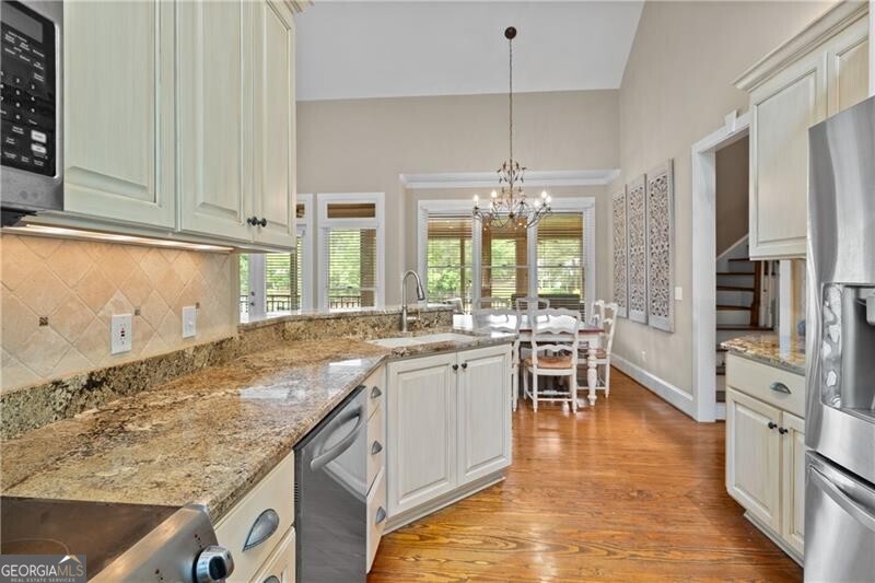 1041 Fox Chase Run Greensboro, GA 30642 - Photo 27 of 45 a kitchen with lots of counter top space and wooden floor