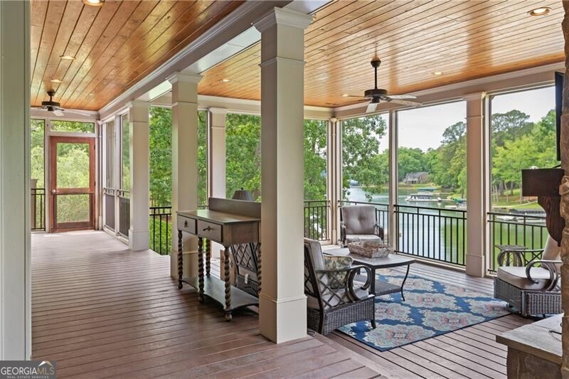 1041 Fox Chase Run Greensboro, GA 30642 - Photo 31 of 45 a view of a porch with furniture and wooden floor