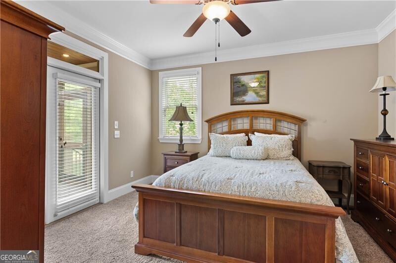 1041 Fox Chase Run Greensboro, GA 30642 - Photo 32 of 45 a bedroom with a bed and a window