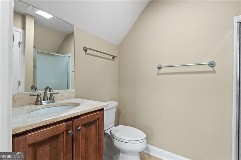1041 Fox Chase Run Greensboro, GA 30642 - Photo 39 of 45 a bathroom with a sink a toilet and a mirror