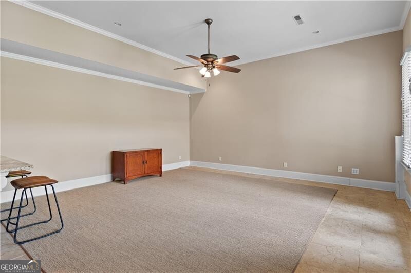 1041 Fox Chase Run Greensboro, GA 30642 - Photo 41 of 45 an empty room with windows and fan