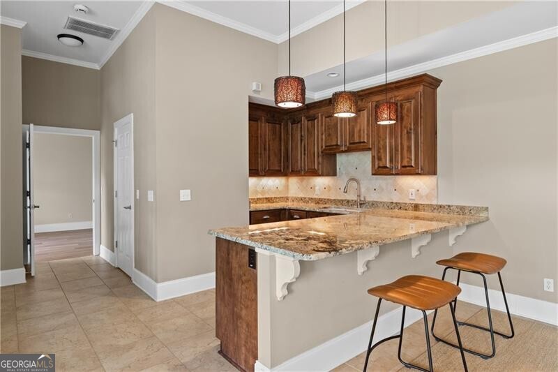 1041 Fox Chase Run Greensboro, GA 30642 - Photo 42 of 45 a kitchen with stainless steel appliances granite countertop a stove and a cabinets