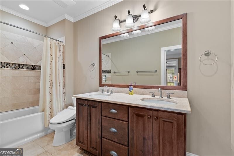 1041 Fox Chase Run Greensboro, GA 30642 - Photo 45 of 45 a bathroom with a toilet a sink and a large mirror