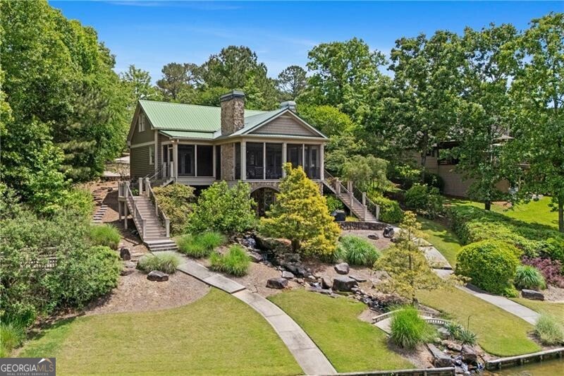 1041 Fox Chase Run Greensboro, GA 30642 - Photo 6 of 45 a view of a house with a yard and garden