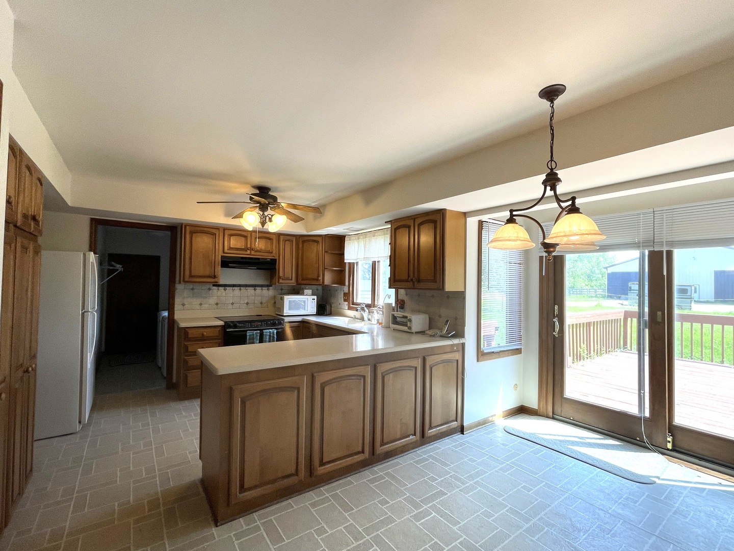 40W883 Plank Road Elgin, IL 60124 - Photo 25 of 47 a kitchen with a sink and refrigerator