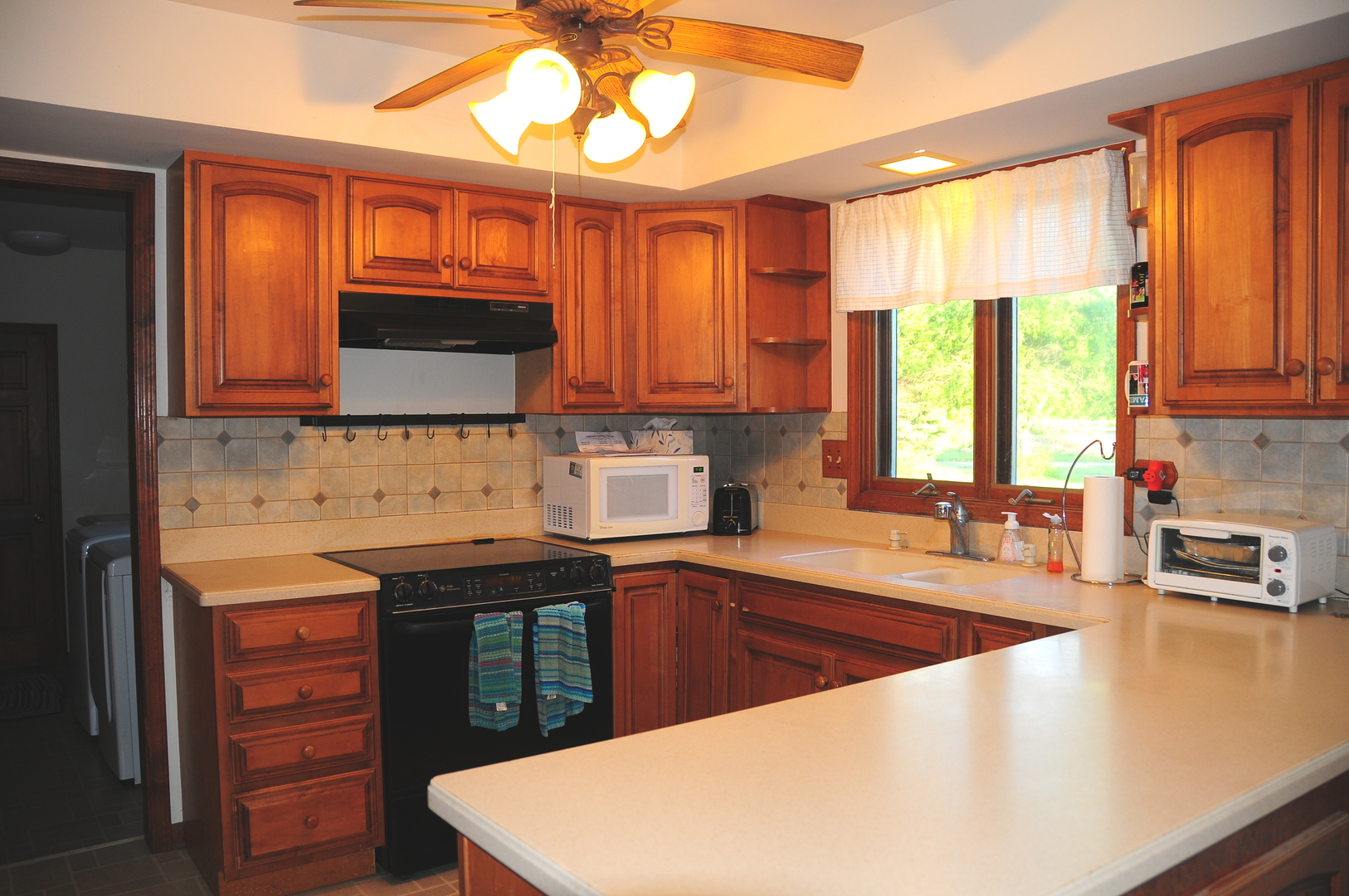 40W883 Plank Road Elgin, IL 60124 - Photo 26 of 47 a kitchen with stainless steel appliances a sink a stove a microwave cabinets and a refrigerator