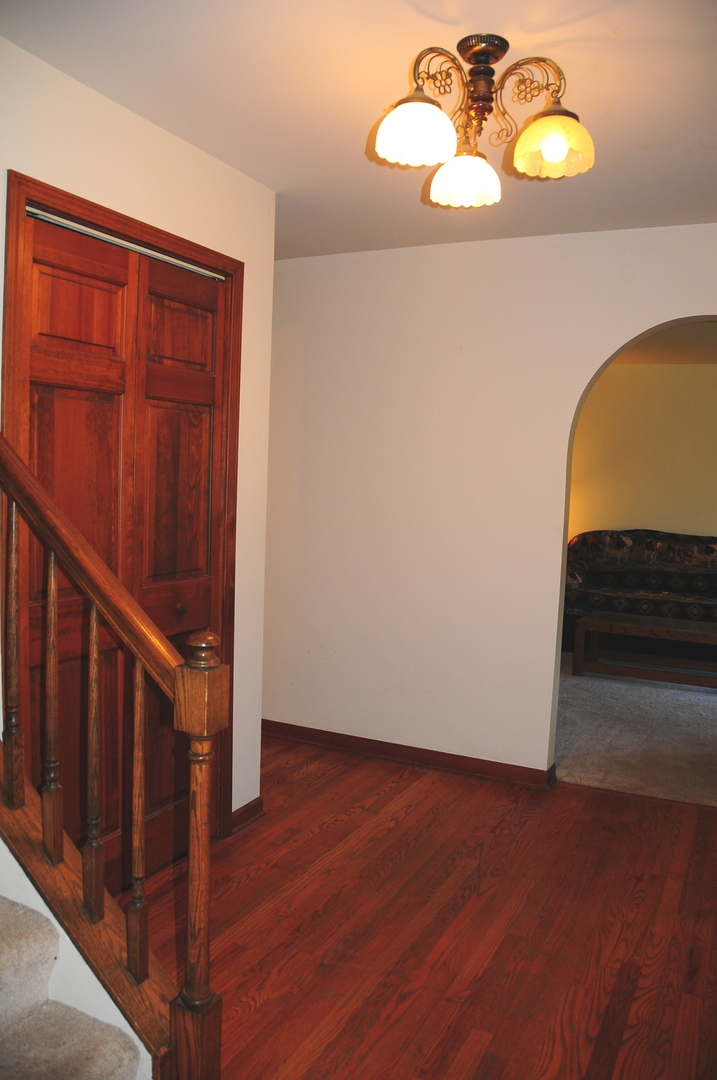 40W883 Plank Road Elgin, IL 60124 - Photo 30 of 47 a view of a chandelier fan and wooden floor