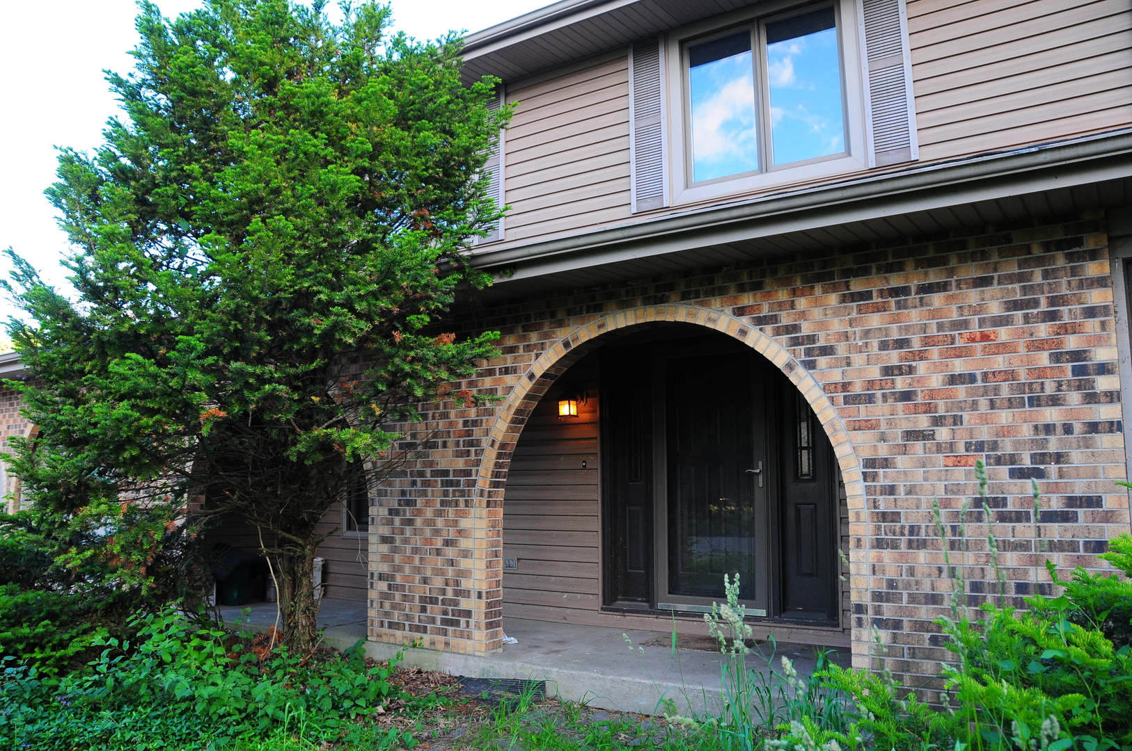 40W883 Plank Road Elgin, IL 60124 - Photo 3 of 47 a front view of a house with plants
