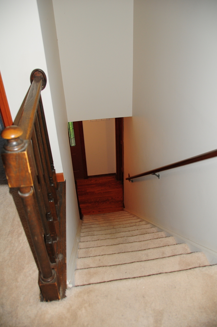 40W883 Plank Road Elgin, IL 60124 - Photo 41 of 47 a view of staircase with white walls and railing