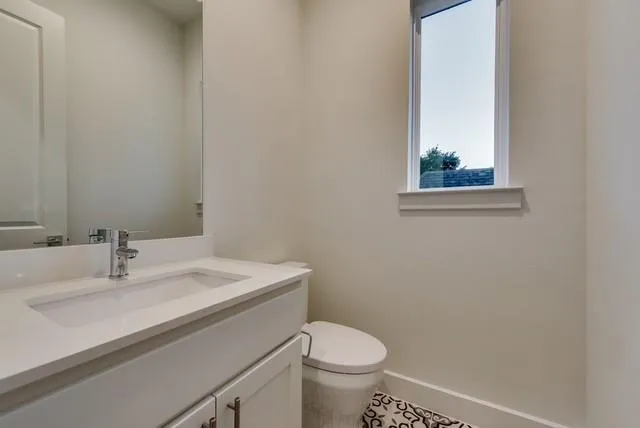 a bathroom with a sink and a toilet