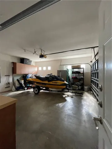 a room with gym equipment and a table