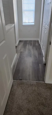 a view of staircase with white walls