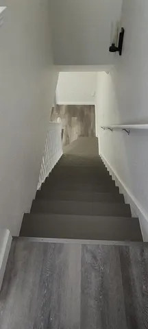 a view of room with window and hardwood floor