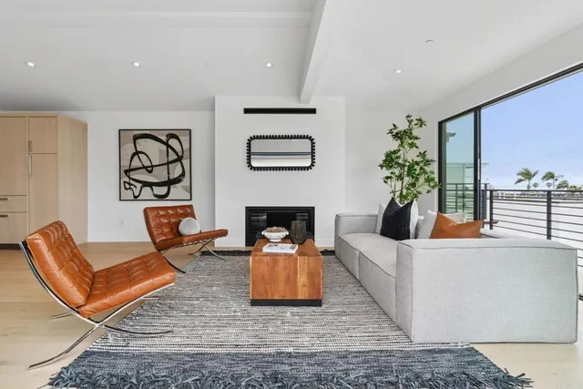 a bedroom with a large bed and a potted plant