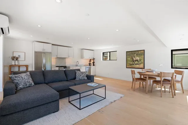 a kitchen with appliances a sink and a refrigerator