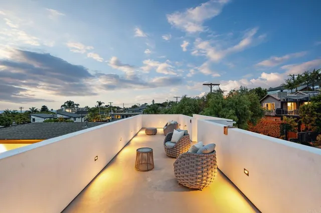 an aerial view of a house and outdoor space